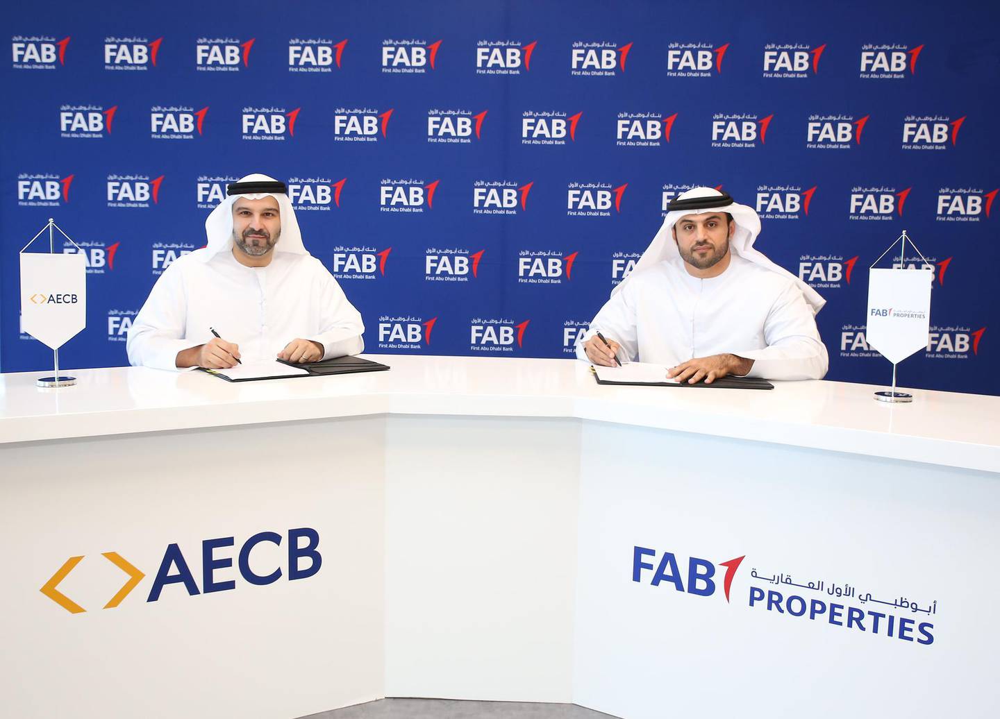 Jasim Al Ali, chief executive of FAB Properties left, and Marwan Lutfi, chief executive of AECB. FAB Properties said the bureau's credit services will help the company assess “the risk associated with tenants fulfilling their payment obligations”. Courtesy Fab Properties