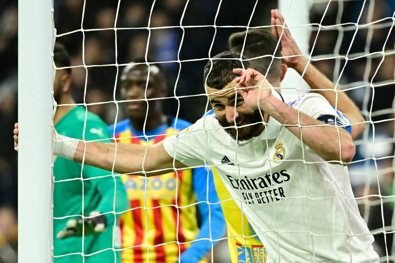 Real Madrid's French forward Karim Benzema reacts to missing a chance to score during the Spanish league football match between Real Madrid CF and Valencia CF at the Santiago Bernabeu stadium in Madrid on February 2, 2023.  (Photo by JAVIER SORIANO  /  AFP)