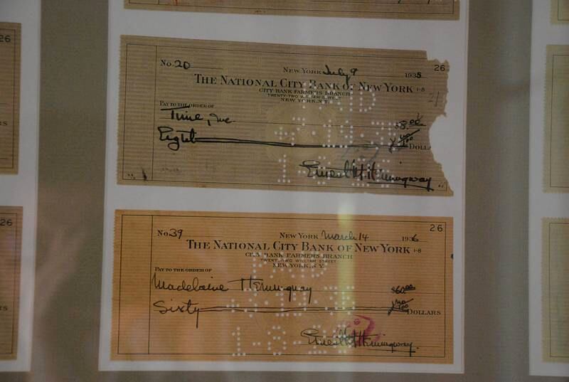 Cancelled payments once owned by Ernest Hemingway hang in the house. Photo: Adam Fagen