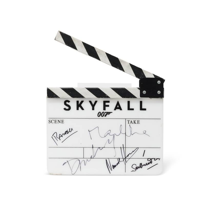A clapperboard used in 'Skyfall', signed by Sam Mendes, Daniel Craig, Berenice Marlohe, Naomie Harris and Javier Bardem. Estimate: £5,000-£7,000. Photo: Christie's