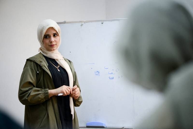 Majda Al-Riyani, a 29-year-old Libyan woman, teaches Arabic calligraphy to young girls at a training centre in Benghazi, Libya, March 15, 2022.  Picture taken March 15, 2022.  REUTERS / Esam Omran Al-Fetori
