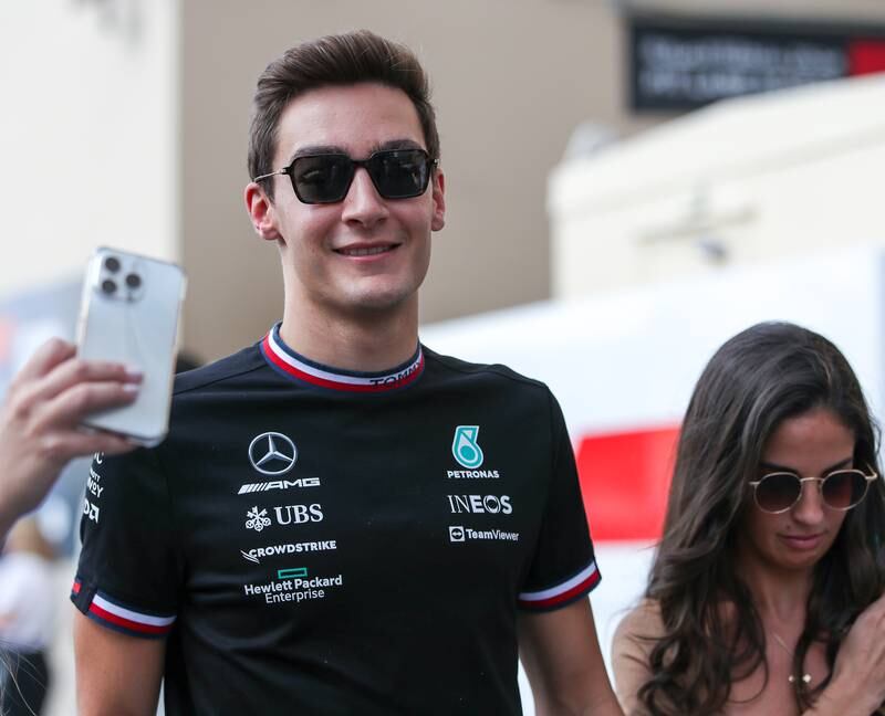 George Russell of Mercedes arrives with girlfriend Carmen Montero at Marina Circuit on the final day  of the Abu Dhabi Grand Prix 2022. Victor Besa / The National