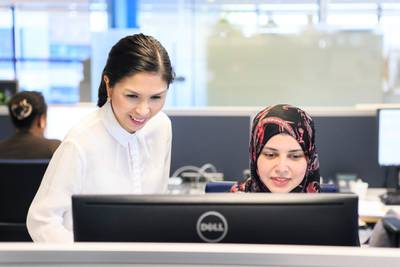 DUBAI, UNITED ARAB EMIRATES, MAY 15, 2016. Ronna Lansang, left, Accounting Manager, Finance & Controlling, Robert Bosch Middle East, with her colleague, Ebaa Hani El-Agha, Accountant, at their office in DAFZA (Dubai Airport Freezone).Robert Bosch Middle East offers working mothers at their company flexible hours and packages to help them work and parent in the UAE.Photo: Reem Mohammed/ The National (Reporter: Suzanne Locke / Section: bz-LIFE) Job ID 51905 *** Local Caption ***  RM_20160515_BOSCH_08.JPG