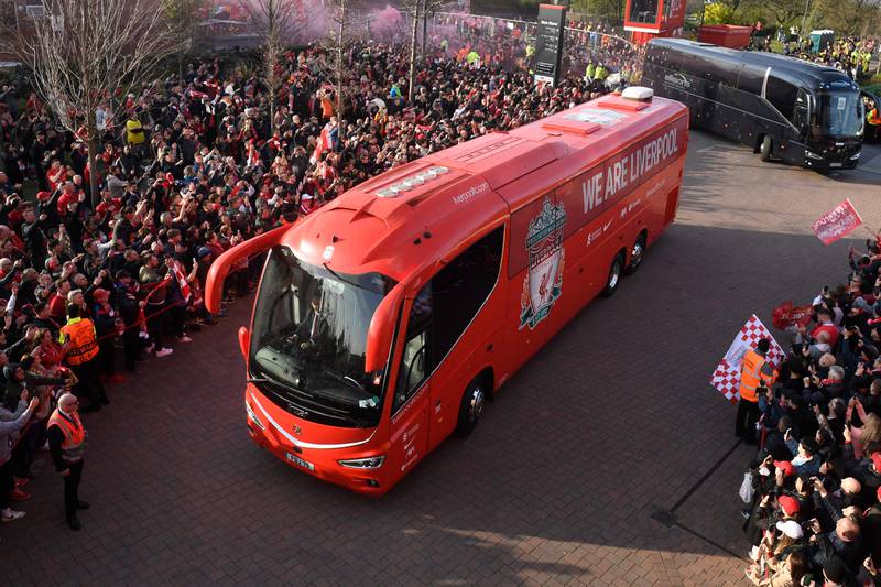 Liverpool's fans cheer as their team bus arrives. AFP