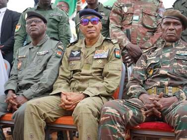 Members of Niger's military-run government, from left, Assahaba Ebankawel, Col Sidi Mohamed and Col Ibroh Amadou Bacharou. EPA