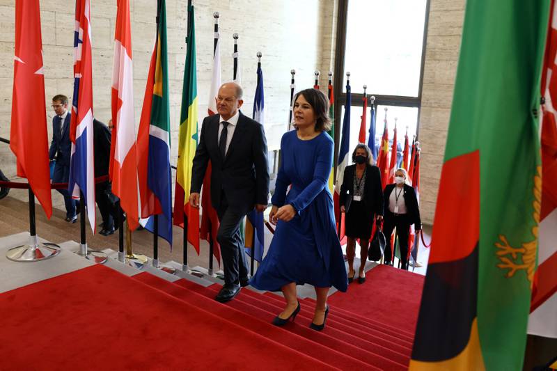 German Chancellor Olaf Scholz and German Foreign Minister Annalena Baerbock arrive at the two-day Petersberg Climate Dialogue in Berlin, Germany. Reuters