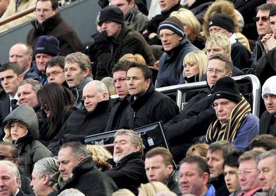 NEWCASTLE, UNITED KINGDOM - APRIL 05: Newcastle's Director of Football Dennis Wise (C) watches alongside Chairman Chris Mort (R)  during the Barclays Premier League Match between Newcastle United and Reading at St James' Park on April 5, 2008 in Newcastle, England.  (Photo by Stu Forster/Getty Images)