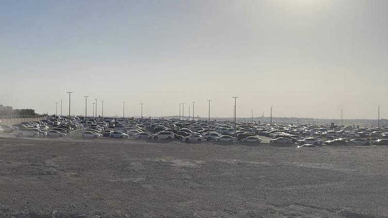 Hundreds of cars are parked at Bani Yas graveyard where Ms Mitchell was laid to rest. Photo: Janaza_UAE