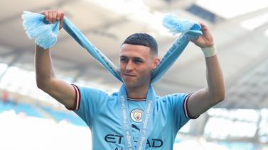 Phil Foden celebrates with fans after Manchester City won the Premier League at the Etihad Stadium on May 21, 2023. Catherine Ivill / Getty Images