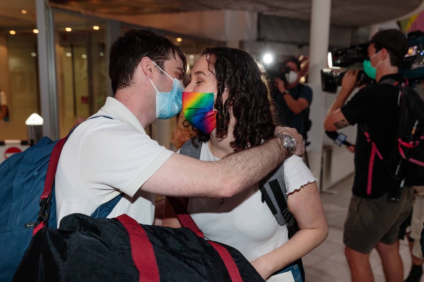 People reunite at Perth Airport in Western Australia after the state reopened its borders to all travel. EPA