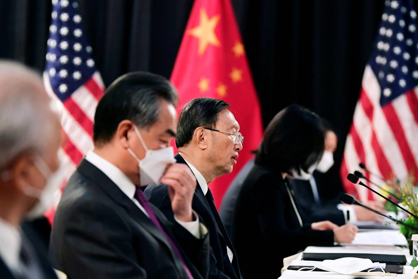 The Chinese delegation led by Yang Jiechi (C), director of the Central Foreign Affairs Commission Office and Wang Yi (2nd L), China's State Councilor and Foreign Minister, speak with their U.S. counterparts at the opening session of U.S.-China talks at the Captain Cook Hotel in Anchorage, Alaska, U.S. March 18, 2021.  Frederic J. Brown/Pool via REUTERS