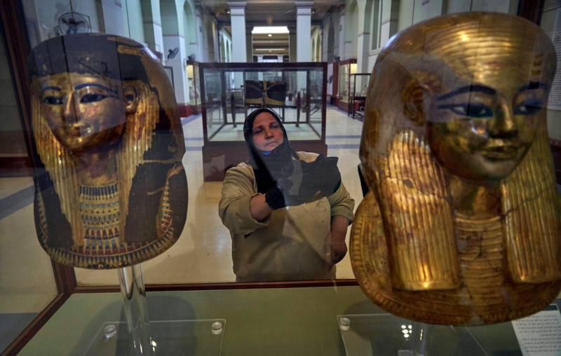A cleaning worker at the Egyptian Museum in central Cairo. AP Photo