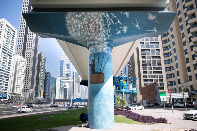 DUBAI, UNITED ARAB EMIRATES - NOVEMBER 12, 2018. The Dubai Metro Murals Project.This initiative, run by Brand Dubai, will see some of the pillars that hold up the Dubai Metro painted by two international artists, Peruvian Daniel Cortez and Dominican-born, Miami-based Elio Mercado, known as Evoca1. These two artists will paint the pillars in between the DIFC and Emirates Towers stations.(Photo by Reem Mohammed/The National)Reporter: Section:  NA