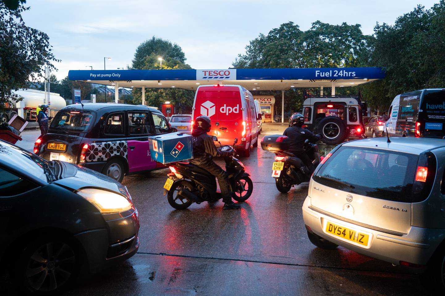Drivers queue for fuel at a petrol station in south London as petrol stations across the UK continue to be affected by a shortage of HGV drivers. PA