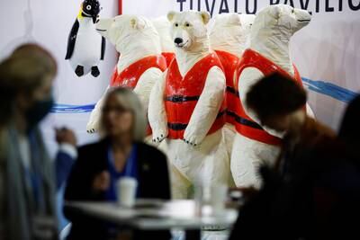 Statues of polar bears wearing life jackets are on display at the summit. Reuters