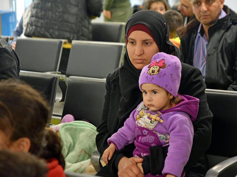 epa06485202 A little girl sits on a woman's laps as new group of Syrian refugees arrive at Fiumicino airport from Syria, Rome, Italy, 30 January 2018. A group of Syrian refugees arrived in Rome thanks to 'humanitarian corridors' promoted by the Community of Sant'Egidio, Federation of Evangelical Churches in Italy and Waldesian Table. The 'humanitarian corridor' project provides a safe and legal way for refugees to migrate to Italy from war-stricken countries like Syria.  EPA/TELENEWS
