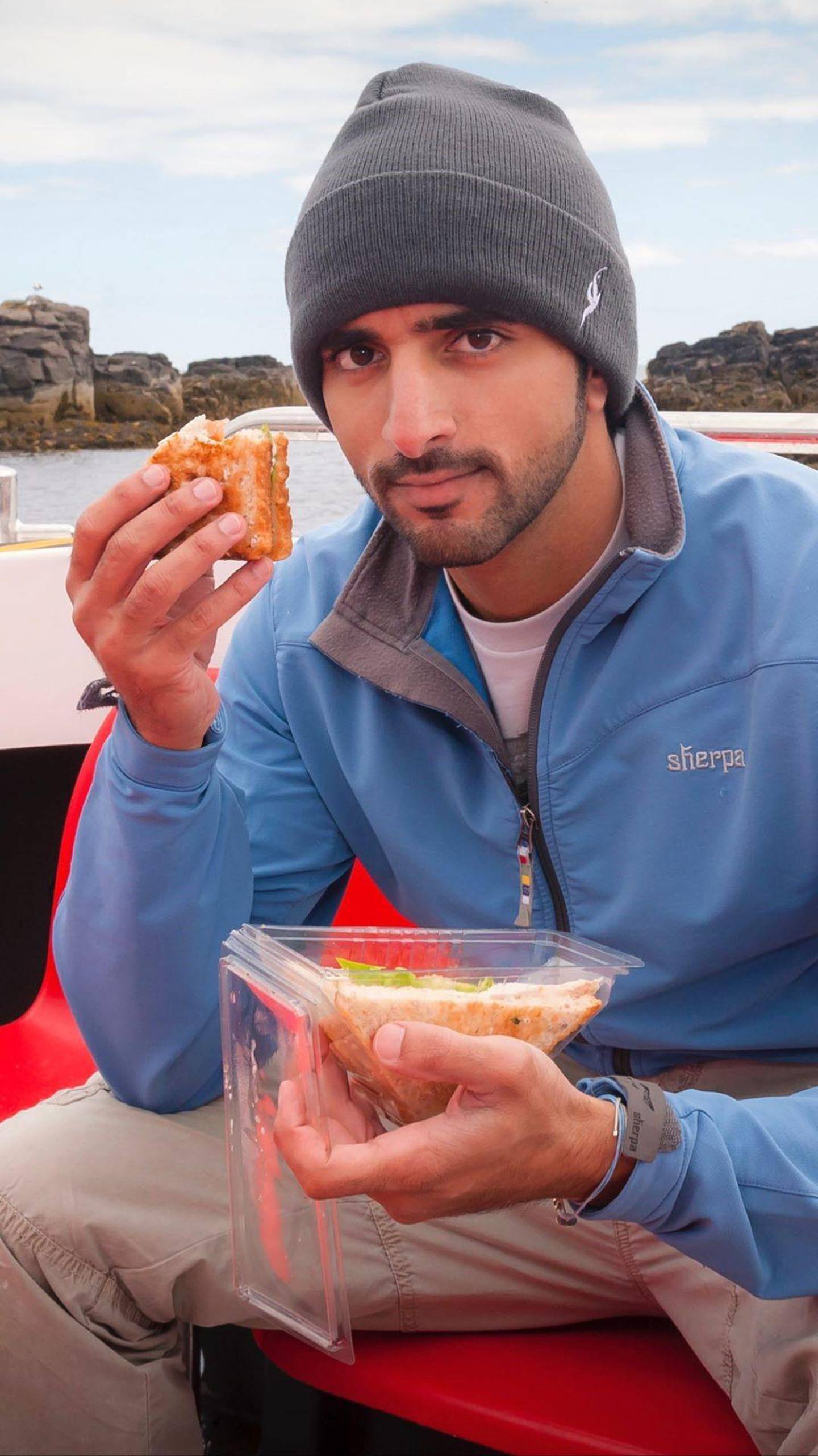Sheikh Hamdan tucks into a pre-packed sandwich on his trip to the Isle of May. Courtesy Instagram / faz3