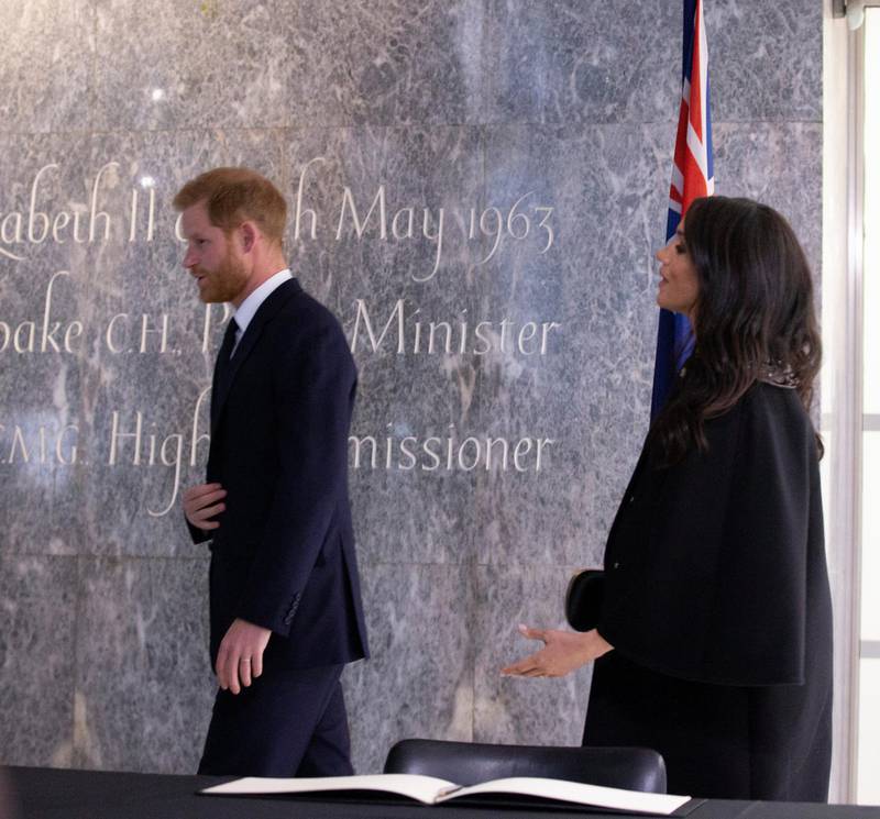 Prince Harry and Meghan, Duchess of Sussex sign a book of condolence on behalf of the Royal Family. Reuters
