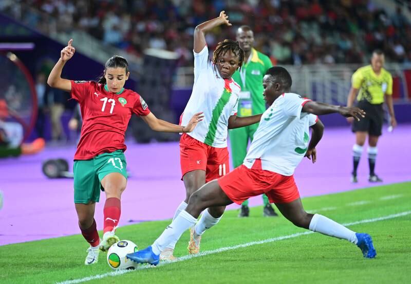 Hanane Ait El Haj, left, of Morocco, in action against Balkissa Sawadogo and Assanato Nako of Burkina Faso.
