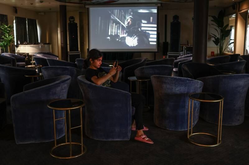 A young survivor in the ship's cinema. More than 50,000 people died and thousands more were injured after earthquakes in southern Turkey and northern Syria