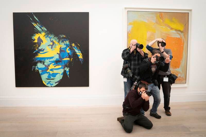 Photographers capture the art collection ahead of the auction on May 16 in New York. PA via AP