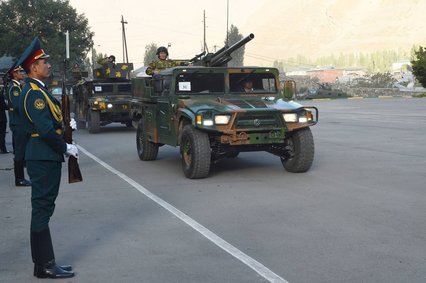 Tajik service members take part in a military parade near the border with Afghanistan in the town of Khorog. Reuters