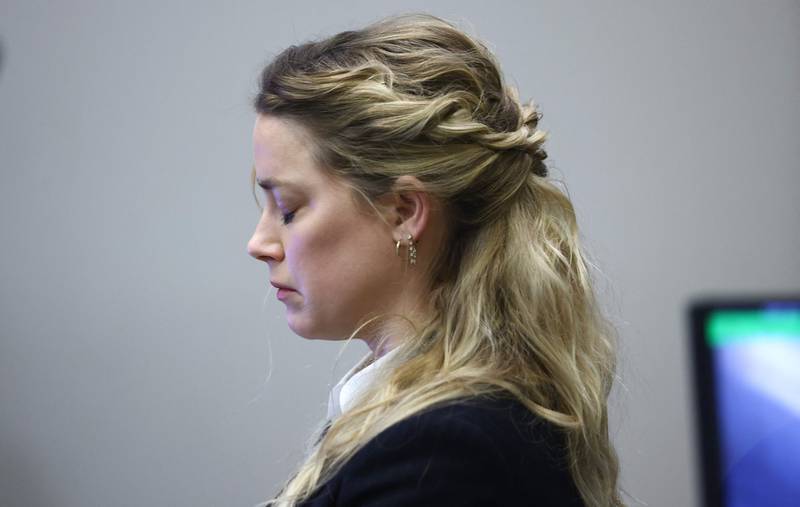 US actress Amber Heard reacts as she listens to an audio recording of she and US actor Johhny Depp arguing. AFP