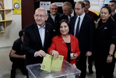 Main opposition alliance presidential candidate Kemal Kilicdaroglu and his wife Selvi arrive to vote at a polling station in Ankara. Getty