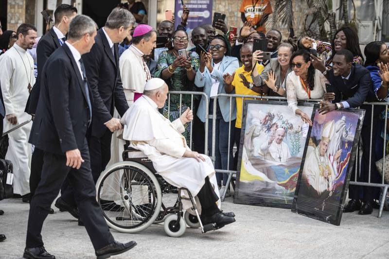Pope Francis greets well-wishers before meeting bishops in Kinshasa. AP Photo