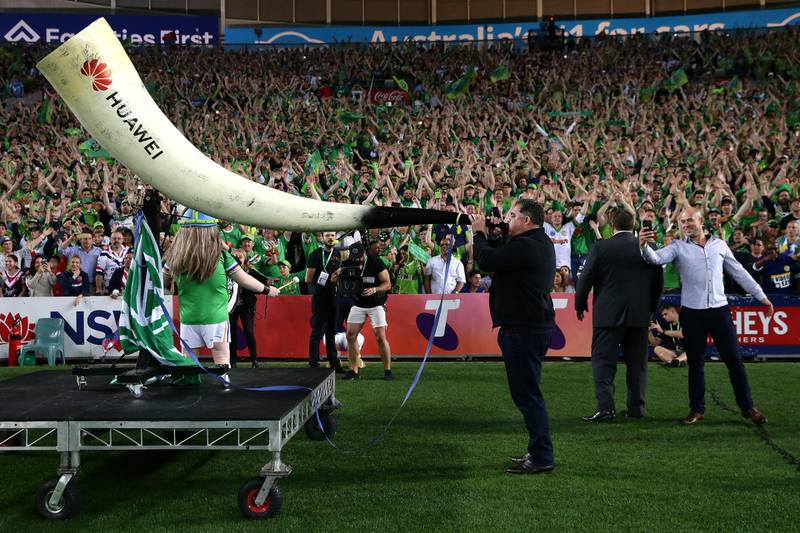 Rugby league legend Mal Meninga blows the horn to commence the Viking Clap Ceremony at the NRL Grand Final match between the Canberra Raiders and the Sydney Roosters on Sunday, October 6. Getty