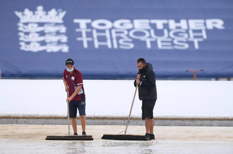 Cricket - Second Test - England v Pakistan - Ageas Bowl, Southampton, Britain - August 15, 2020   Grounstaff clear water from the pitch as rain delays play, as play resumes behind closed doors following the outbreak of the coronavirus disease (COVID-19)   Stu Forster/Pool via REUTERS
