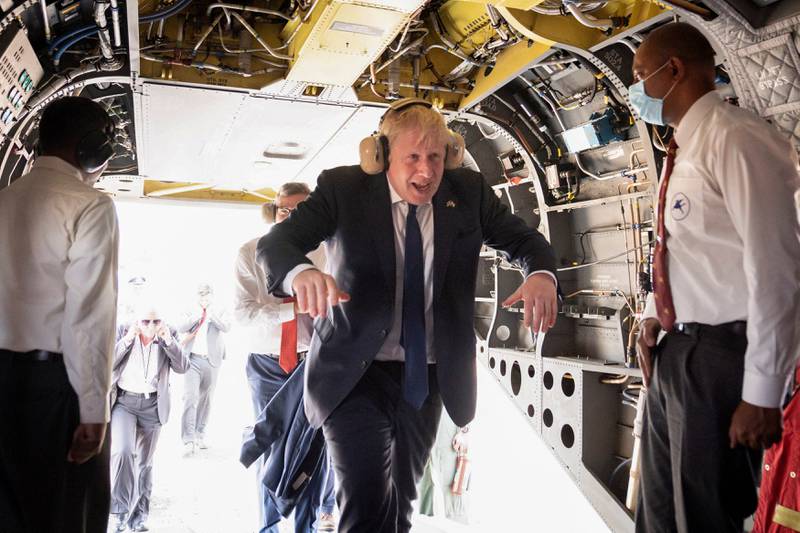 Boris Johnson boards an Indian military Chinook helicopter for a flight to the new JCB factory at Vadodara in India's Gujarat state. Reuters