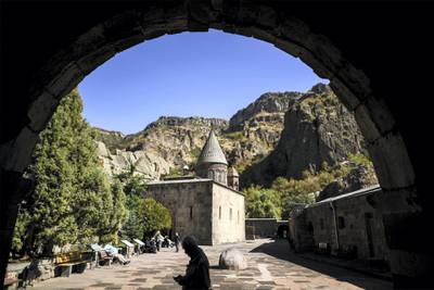 Tourists visit Geghard monastery, some 40kms from Yerevan on October 6, 2017. / AFP PHOTO / Kirill KUDRYAVTSEV