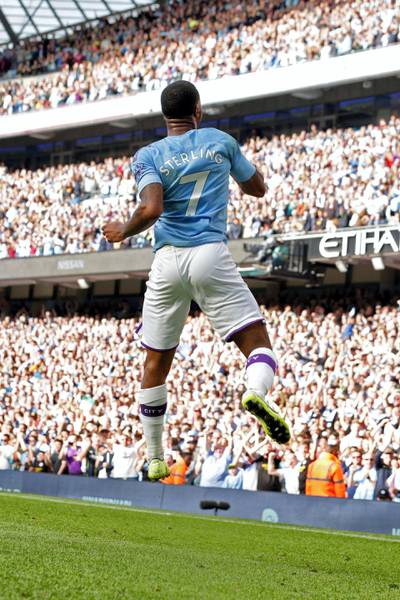 Manchester City's English midfielder Raheem Sterling celebrates scoring his team's first goal during the English Premier League football match between Manchester City and Tottenham Hotspur at the Etihad Stadium in Manchester, north west England, on August 17, 2019. (Photo by Lindsey Parnaby / AFP) / RESTRICTED TO EDITORIAL USE. No use with unauthorized audio, video, data, fixture lists, club/league logos or 'live' services. Online in-match use limited to 120 images. An additional 40 images may be used in extra time. No video emulation. Social media in-match use limited to 120 images. An additional 40 images may be used in extra time. No use in betting publications, games or single club/league/player publications. / 