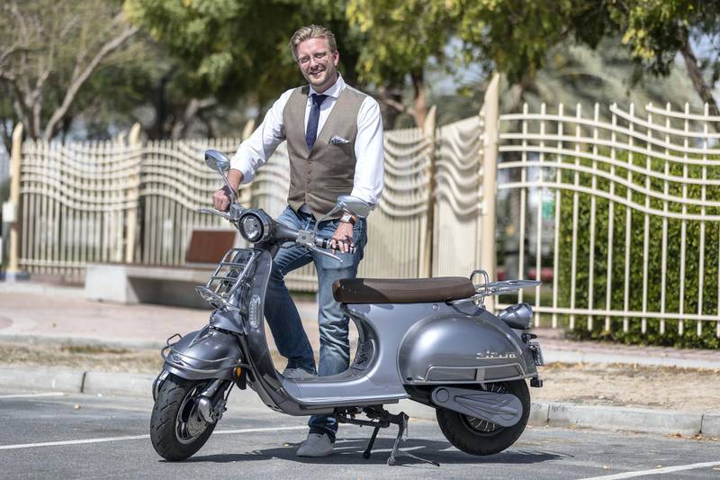DUBAI, UNITED ARAB EMIRATES. 17 FEBRUARY 2020. One Moto electric scooter styled after the popular Vespa scooter design. Adam Ridgway, founder of ONE MOTO - Electric Vehicles. (Photo: Antonie Robertson/The National) Journalist: Alkesh Sharma. Section: Business.