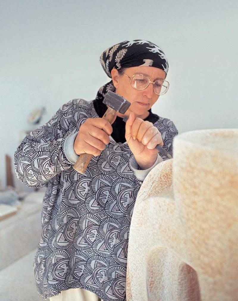 Mona Saudi at work on a sculpture. The Jordanian-Lebanese sculptor has died aged 76. Photo: Lawrie Shabibi Gallery