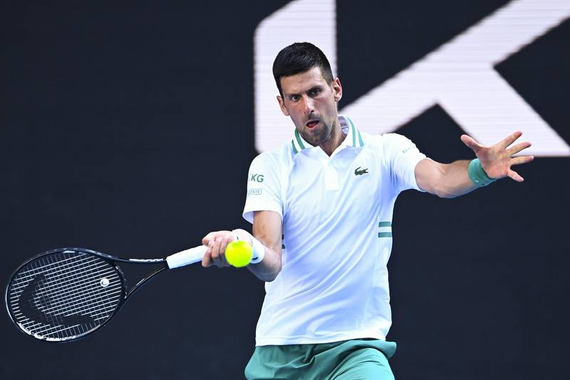 epa09000476 Novak Djokovic of Serbia in action during his second Round Men's singles match against Frances Tiafoe of the United States of America on Day 3 of the Australian Open at Melbourne Park in Melbourne, Australia, 10 February 2021.  EPA/DAVE HUNT AUSTRALIA AND NEW ZEALAND OUT