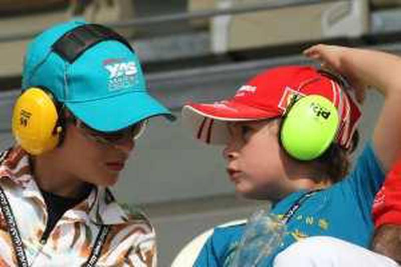 ABU DHABI. 30th October. 2009. ABU DHABI GRAND PRIX. FRIDAY A young fan gets some tips from his mother Stephen Lock   /   The National   *** Local Caption ***  SL-gpfri-010.jpg