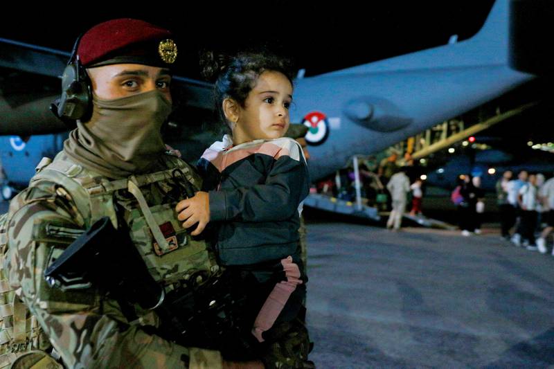 This child was one of those to have arrived safely in Amman. AFP