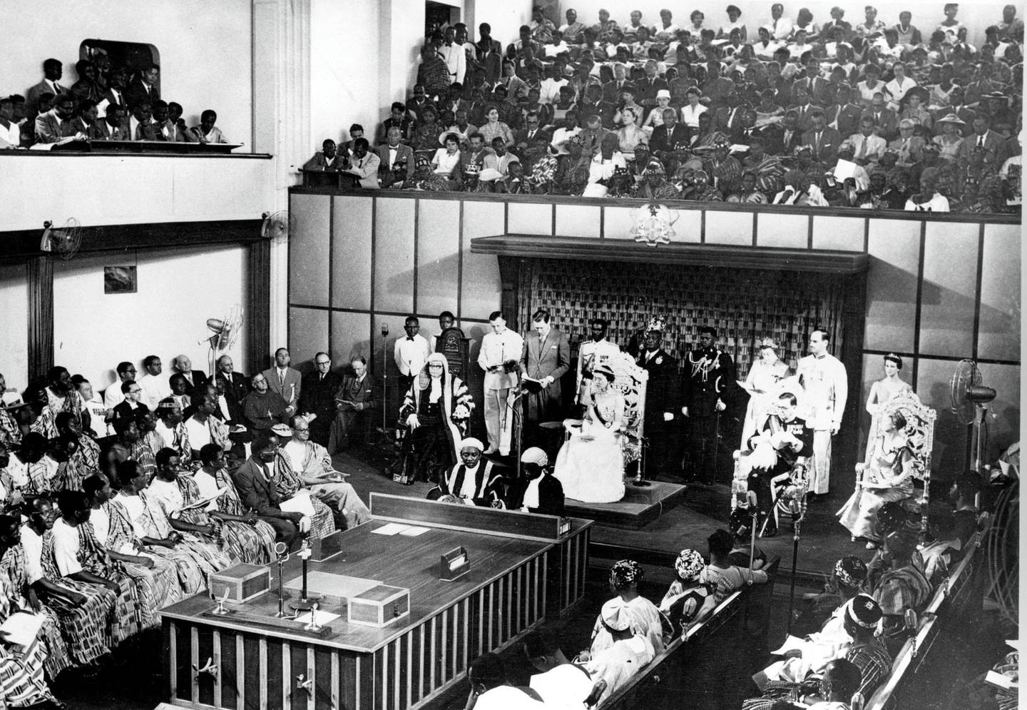 The Duchess of Kent, seated center on dais, reads a message from the Queen of England in the Parliament House at Accra, Ghana, on March 6, 1957.  Ghana, British colony known as the Gold Coast, is the first black African nation to gain independence from colonial rule.  Seated at right is the Governor General Sir Charles Noble Arden-Clarke and at far right is Lady Arden-Clarke.  (AP Photo)