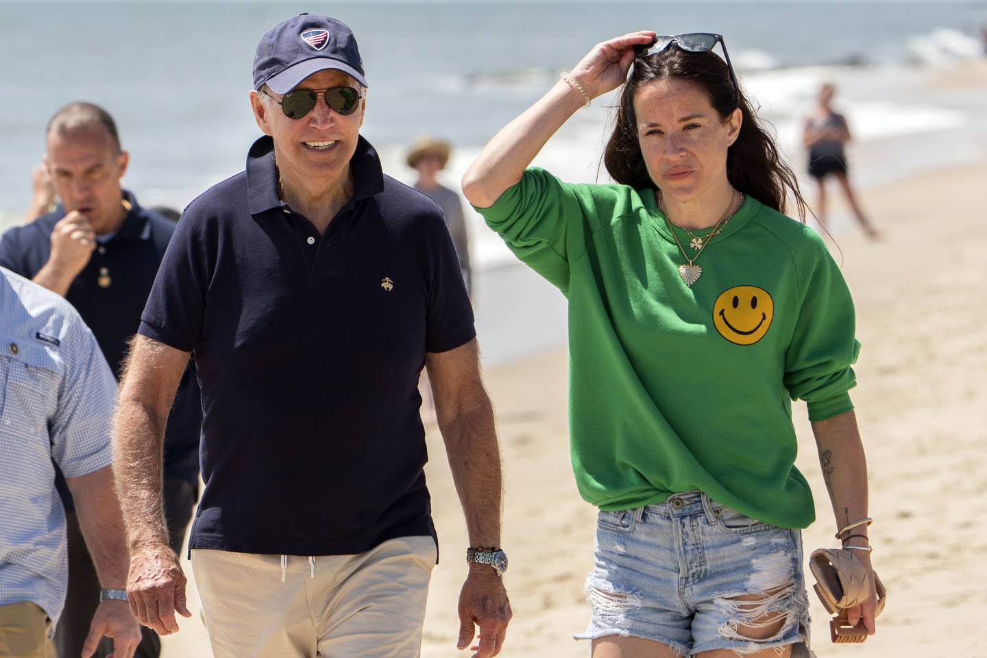 President Joe Biden walks on the beach with daughter Ashley Biden, in Rehoboth Beach, Delaware. AP