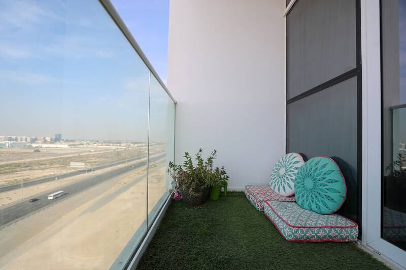 Ms Talaat installed artificial turf on her balcony as greenery is important to her.