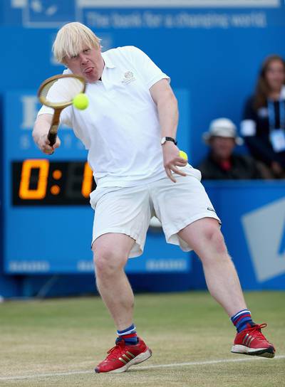 LONDON, ENGLAND - JUNE 16:  London Mayor Boris Johnson in action during the Rally Against Cancer charity match on day seven of the AEGON Championships at Queens Club on June 16, 2013 in London, England.  (Photo by Clive Brunskill/Getty Images)