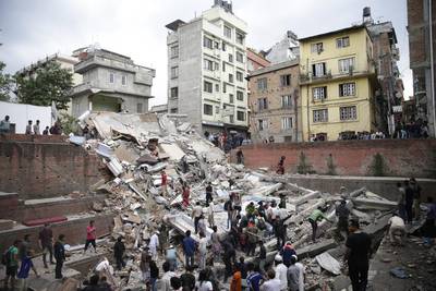 People search for survivors stuck under the rubble of a destroyed building, after an earthquake caused serious damage in Kathmandu, Nepal. Narendra Shrestha / EPA 