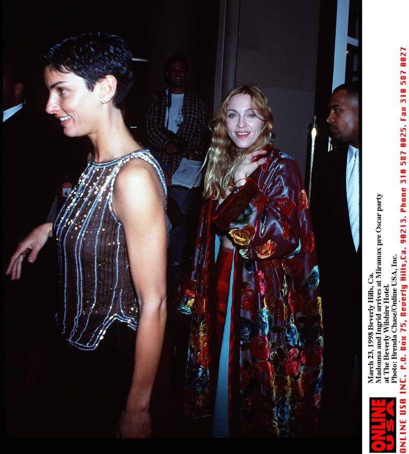March 22, 1998 Beverly Hills Madonna with friend Ingrid as he arrives atThe Miramax Oscar''98 pre Oscar party at The Beverly Wilshire Hotel.