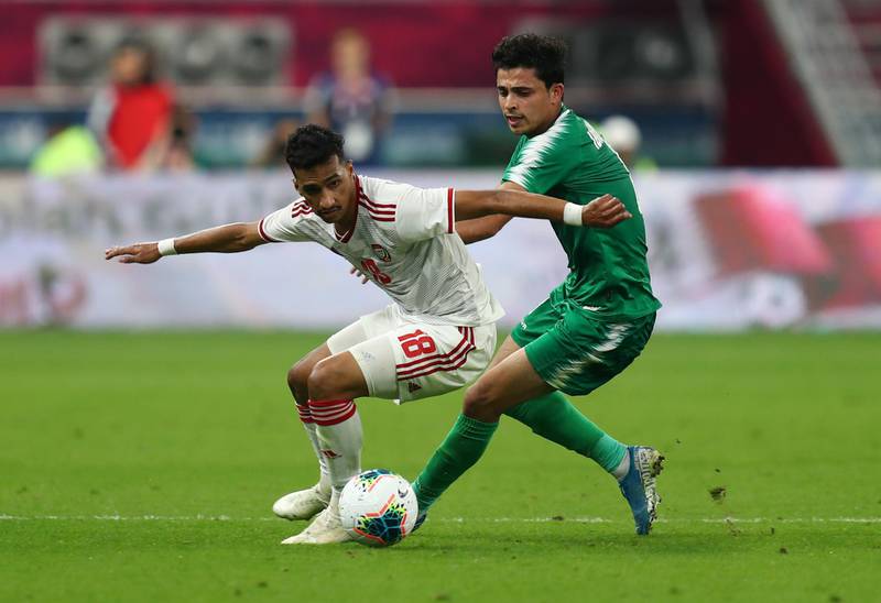 UAE player Abdalla Ramadan in action with Iraq's Ibraheem Bayesh. Reuters