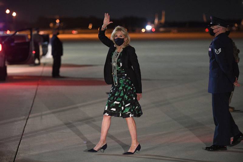 Jill Biden, in a geometric green and black dress, arrives at Andrews Air Force Base in Maryland on April 23, 2021. AFP
