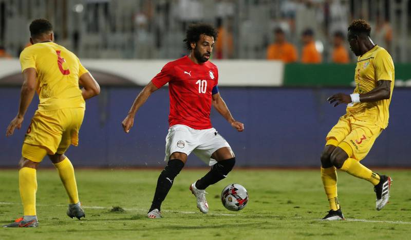 Salah in action with Guinea's Issiaga Sylla. Reuters