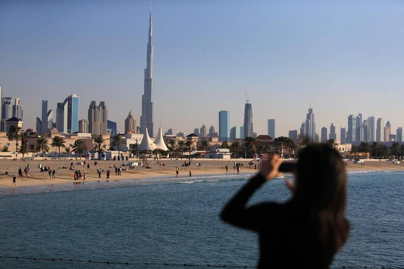 DUBAI, UAE. January 4, 2014 -  A tourist takes a photo of the skyline and the shores of Jumeirah Open Beach in Dubai, January 4, 2014.  (Photo by: Sarah Dea/The National, Story by: STANDALONE, News)


