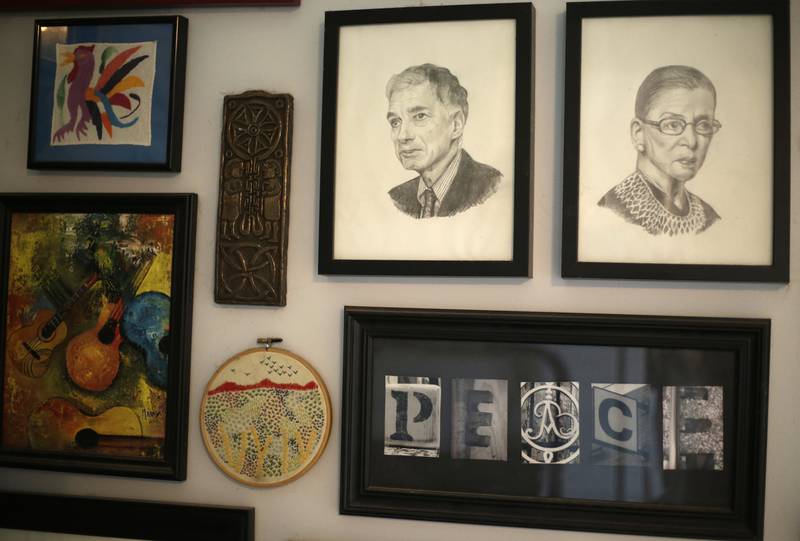 Sketches of political activist Ralph Nader and Ginsburg hang on a wall of Alison Dreith's home in southern Illinois. AP